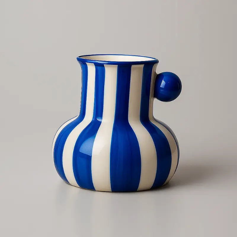 Collection of striped ceramic pitcher vases in green red blue black and yellow with flowers
