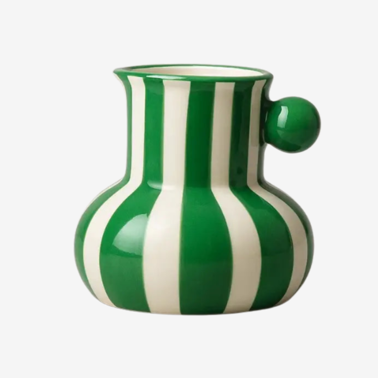 Collection of striped ceramic pitcher vases in green red blue black and yellow with flowers