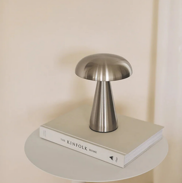 Brushed steel mushroom lamp styled on Kinfolk book minimalist beige decor
