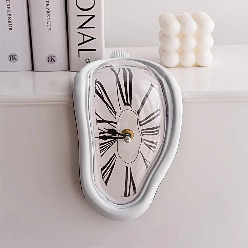 Silver surrealist melting clock resting on the edge of a metal bookshelf next to books